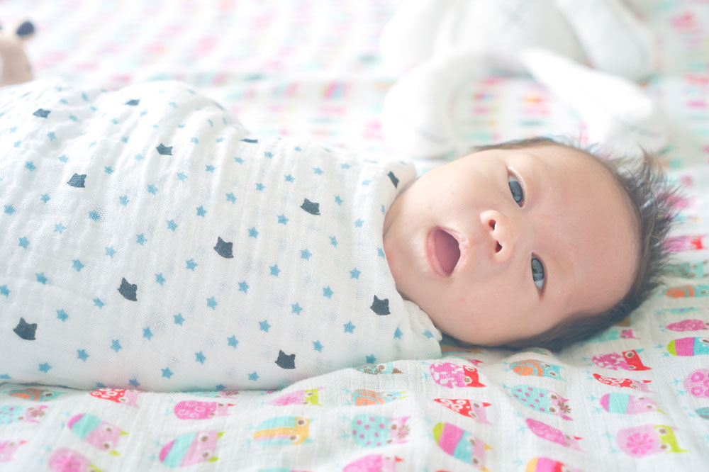 Key things to know about swaddling and receiving blankets